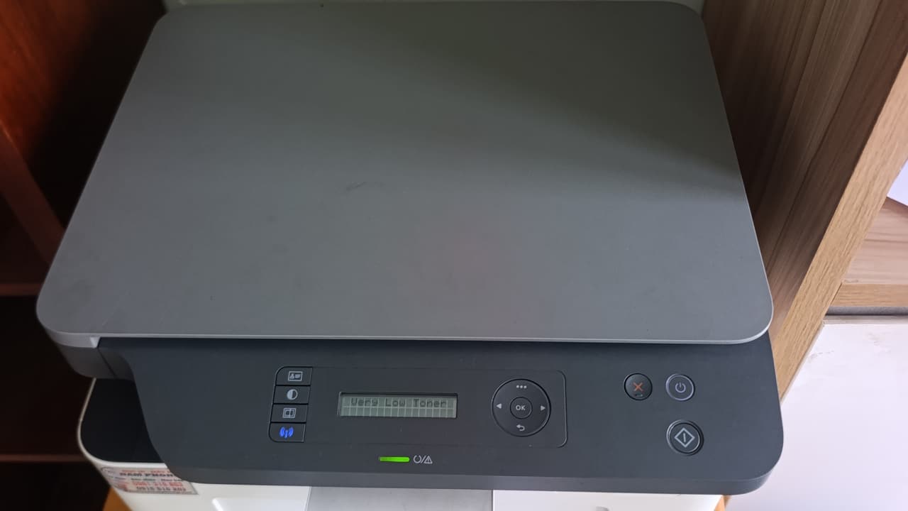 Máy in nhỏ đặt tại quầy cửa hiệu — kiểu dùng của hộ kinh doanh Quận 5